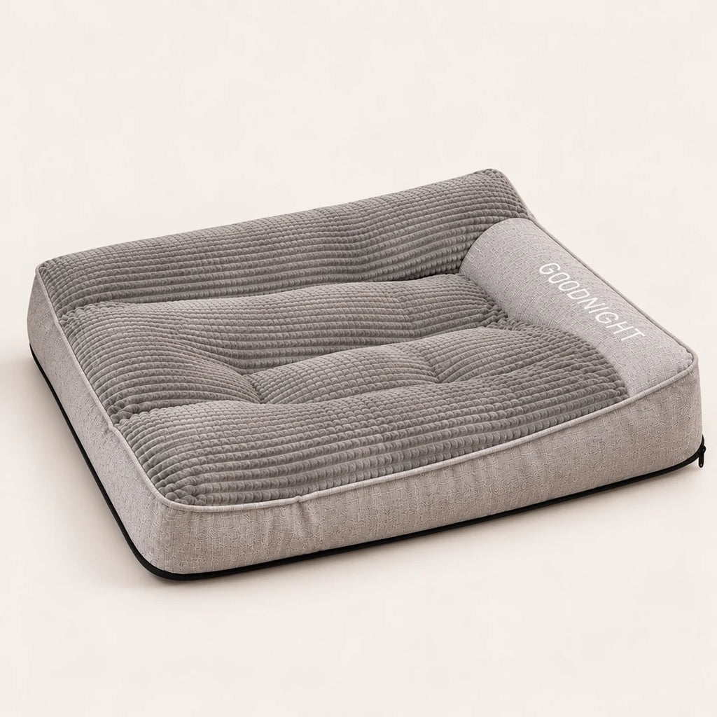 Lit orthopédique pour chien gris GOODNIGHT, vue studio avec rebords surélevés